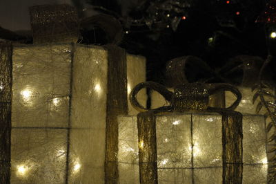 Close-up of illuminated lamp hanging at night