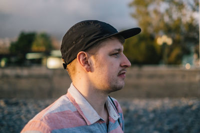 Young man looking away outdoors