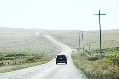Car on country road against sky