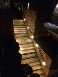 High angle view of empty narrow pathway along walls