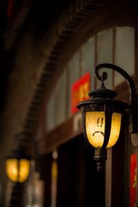 Close-up of lantern hanging in row