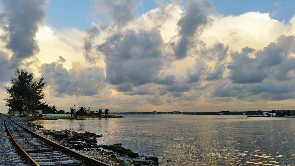 water, sky, cloud - sky, nature, outdoors, scenics, sea, nautical vessel, beach, no people, tranquil scene, beauty in nature, tree, landscape, vacations, day