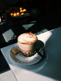 Close-up of coffee cup on table