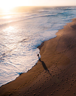 High angle view of sea against sky during sunset