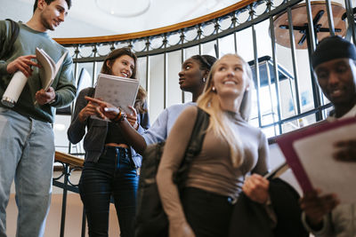 Portrait of young woman using mobile phone