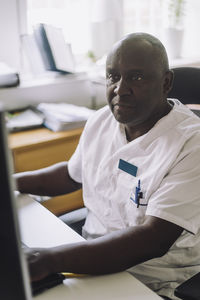 Focused male doctor working at hospital