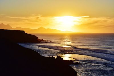 Scenic view of sea against sky during sunset