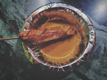 High angle view of fish on barbecue grill