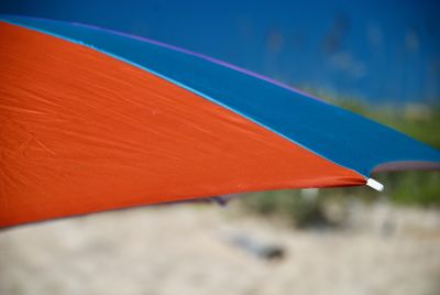 Close up of red and blue beach umbrella