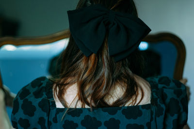 Woman holding a mirror at home