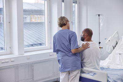 Nurse taking care of patient in hospital