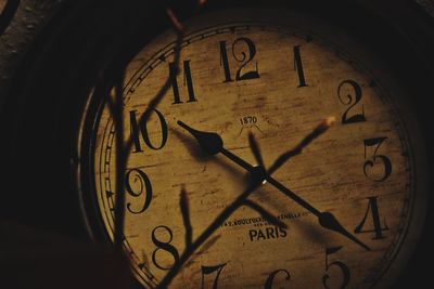 Close-up of clock on brick wall