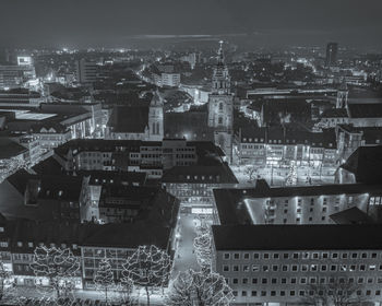 High angle view of illuminated buildings in city