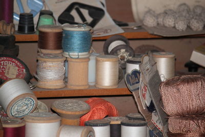 Close-up of various containers in shelf