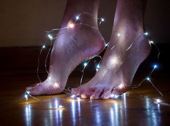 Illuminated sexy feet of a woman 