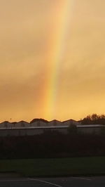 Scenic view of rainbow against sky during sunset