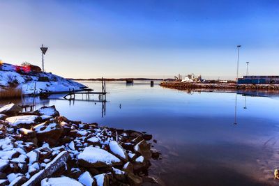 Scenic view of frozen sea against sky during sunset