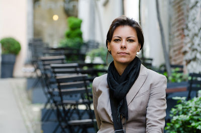 Portrait of young woman in city