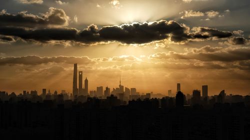 Panoramic view of modern buildings against sky during sunset