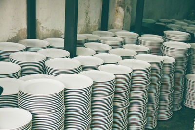 High angle view of plates stacked 