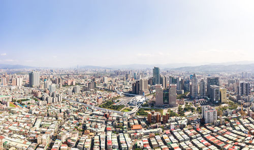 High angle view of modern buildings in city against sky