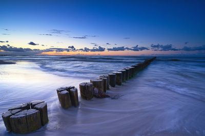 Scenic view of sea against sky at sunset