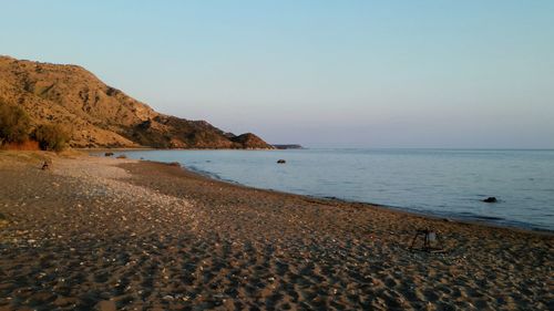 Scenic view of beach against clear sky