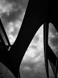 Low angle view of suspension bridge against sky