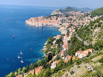 High angle view of townscape by sea