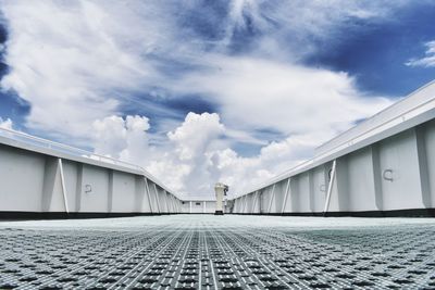 Walkway against sky