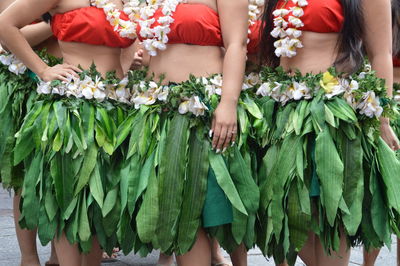Midsection of women wearing traditional clothing