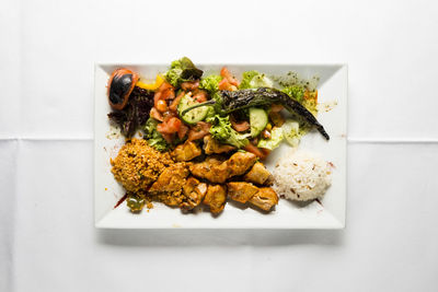 High angle view of vegetables in plate on table