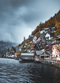 River amidst buildings against sky