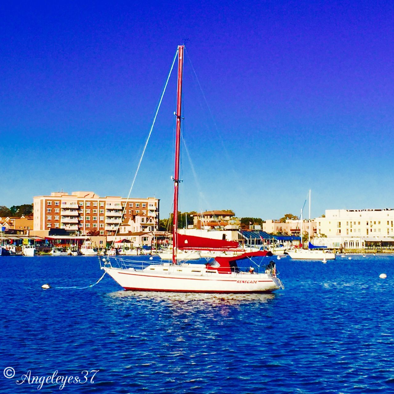 blue, water, nautical vessel, clear sky, transportation, sea, waterfront, boat, copy space, mode of transport, built structure, sailboat, moored, mast, architecture, harbor, day, travel, building exterior, outdoors