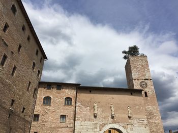 Low angle view of bell tower against sky