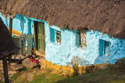 Exterior of house amidst plants and buildings