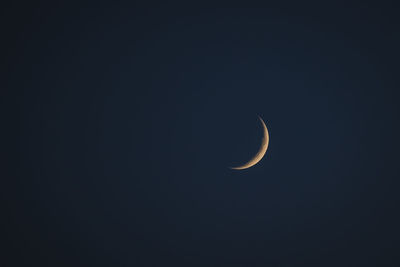 Low angle view of moon against clear sky at night