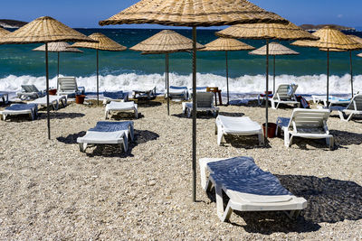 Lounge chairs and parasols at beach