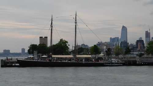 Boats moored at harbor