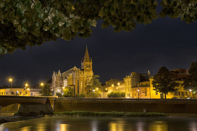 Illuminated buildings at waterfront