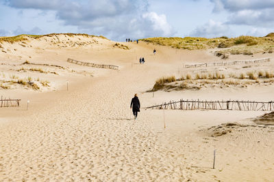 Full length of man in desert against sky