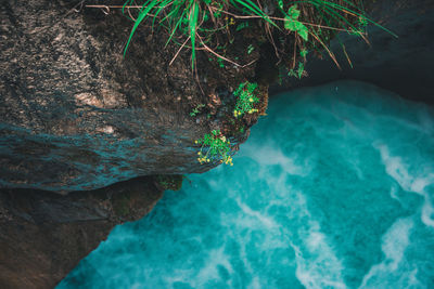 High angle view of rocks by sea