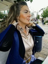 Mid adult woman sitting in car