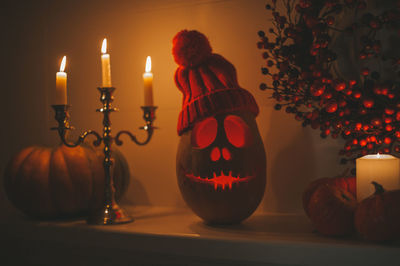 Illuminated jack o lantern on table