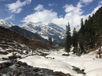 Scenic view of snowcapped mountains against sky