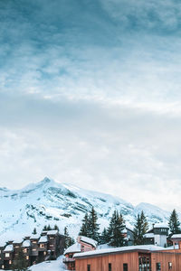 Buildings against sky during winter