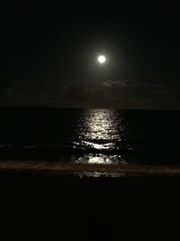 Scenic view of sea against sky at night