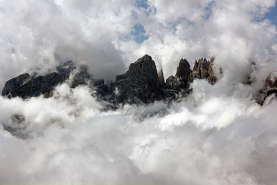 Low angle view of majestic mountains against sky