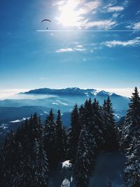 Scenic view of silhouette mountains against sky during winter