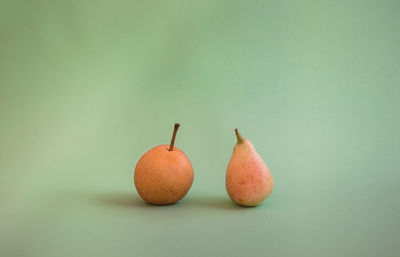 Close-up of oranges against orange background